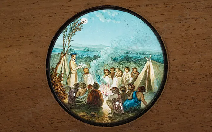 Magic Lantern Slide of a missionary preaching to a gathering of Maori. (c. 1850) Image 1++