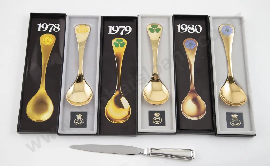 Three boxed George Jensen S/S Gilt Annual Floral Spoons Image 1++