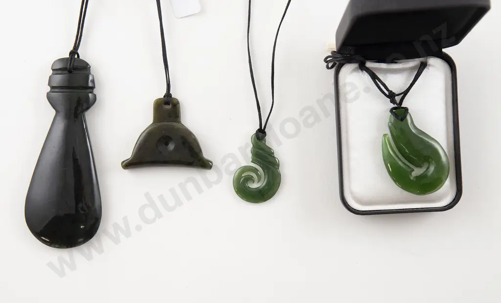 Four Greenstone Pendants Image 1++