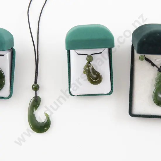 Four Greenstone Pendants