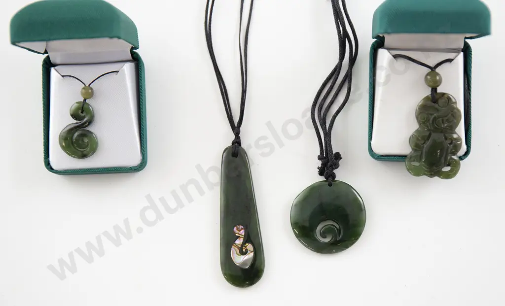 Four Greenstone Pendants Image 1++