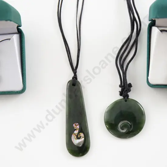 Four Greenstone Pendants