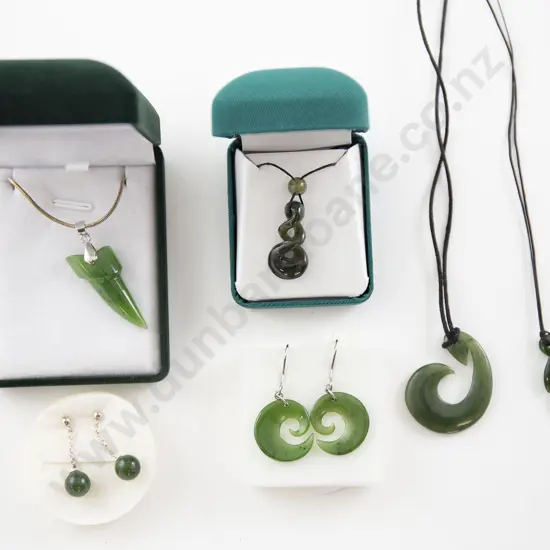 Four Greenstone Pendants