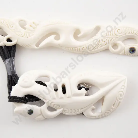 Two NZ Carved Bone Pendants