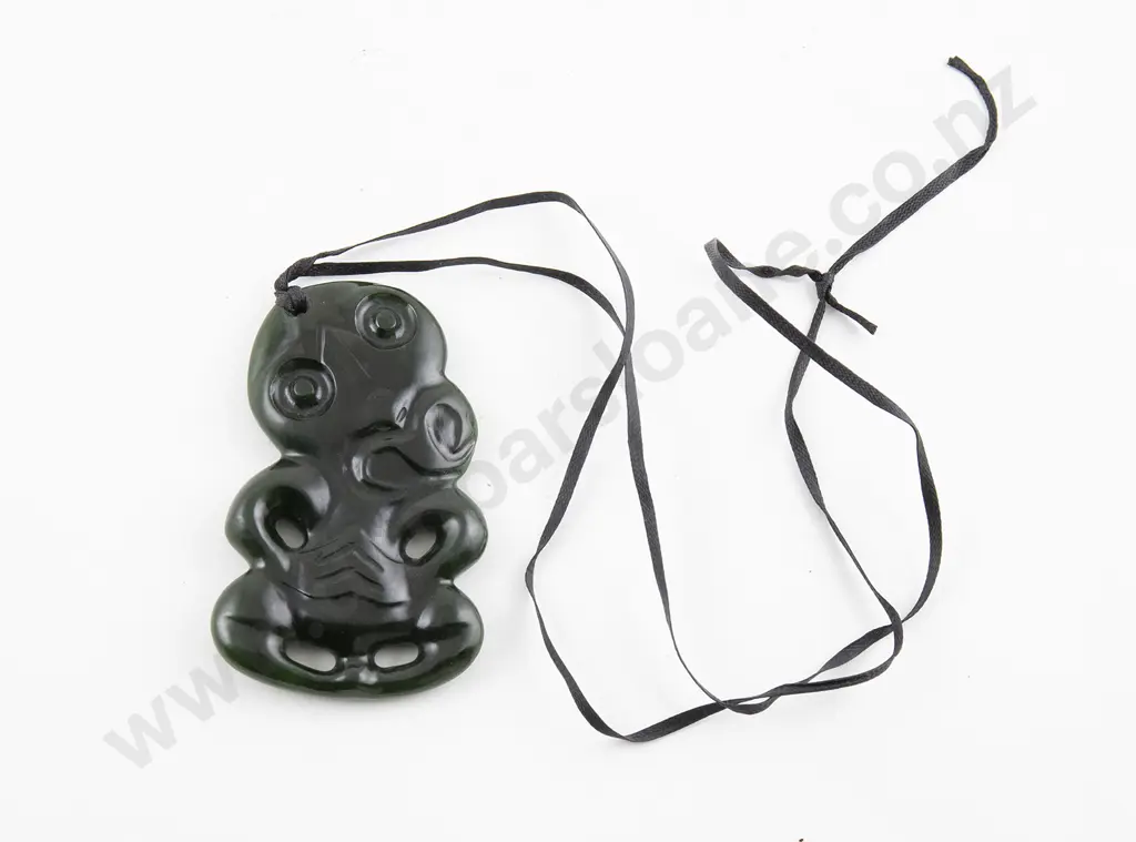 Modern carved greenstone Hei Tiki Image 1++