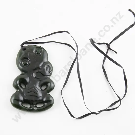 Modern carved greenstone Hei Tiki