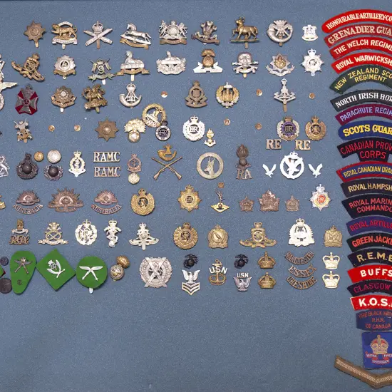 Display Collection of Mainly British Regimental Corps Insignia