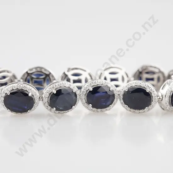 14ct White Gold Sapphire and Diamond Bracelet 12 oval cut dark royal blue sapphires approx 32.94cts tsw