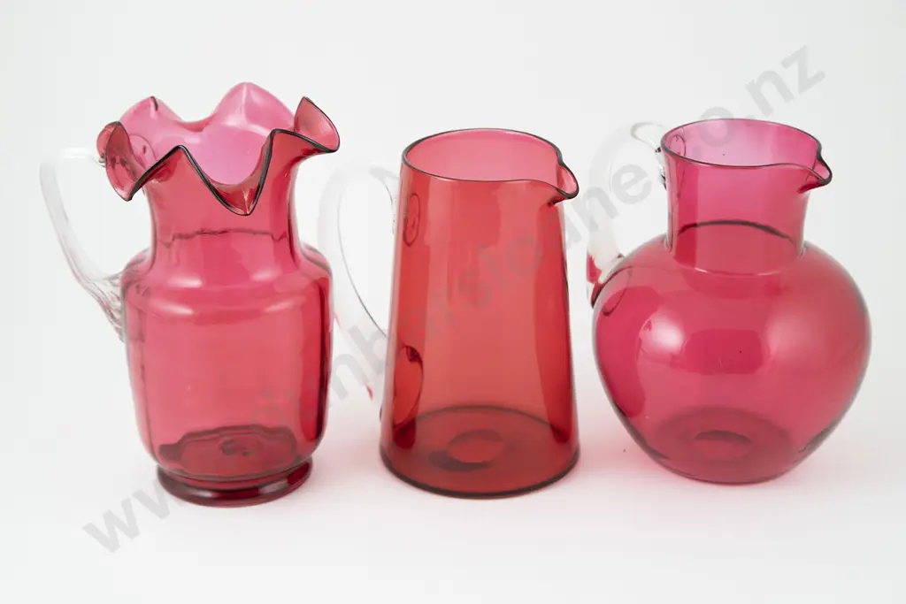 Three Victorian Cranberry Glass Jugs Image 1++