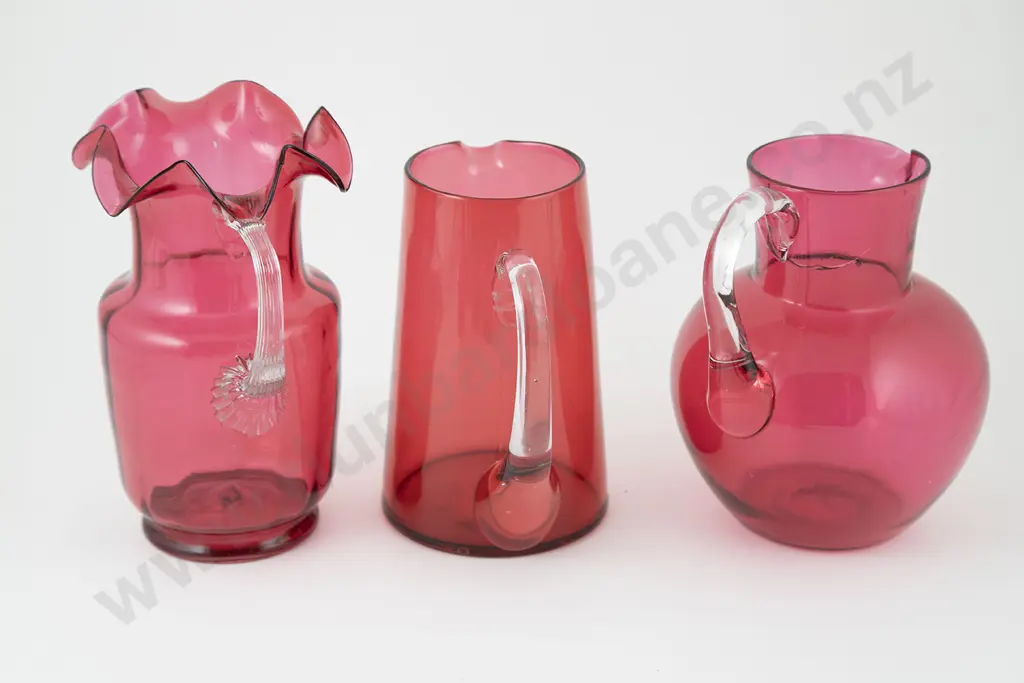 Three Victorian Cranberry Glass Jugs Image 1++