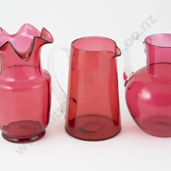 Three Victorian Cranberry Glass Jugs
