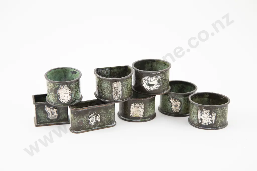 Eight Peruvian Bronze & Silver Overlaid Napkin Rings Image 1++