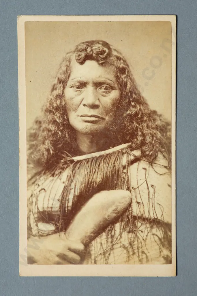 Thomas Edward Price (Masterton)  Portrait of a Maori women wearing a korowai and holding a patu (hand club)  Carte de viste albumen print Image 1++