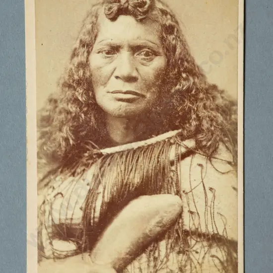 Thomas Edward Price (Masterton)  Portrait of a Maori women wearing a korowai and holding a patu (hand club)  Carte de viste albumen print