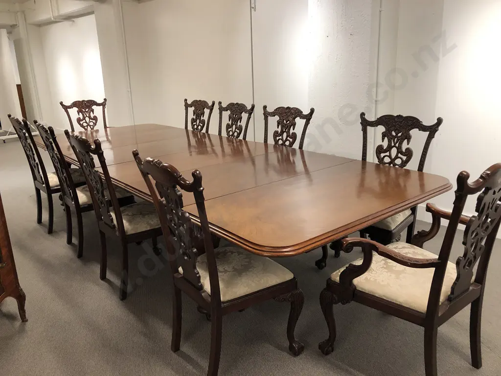 A Superb Victorian Mahogany Extension Dining Table Leaf Holder and Twelve Chippendale Style Chairs Image 1++