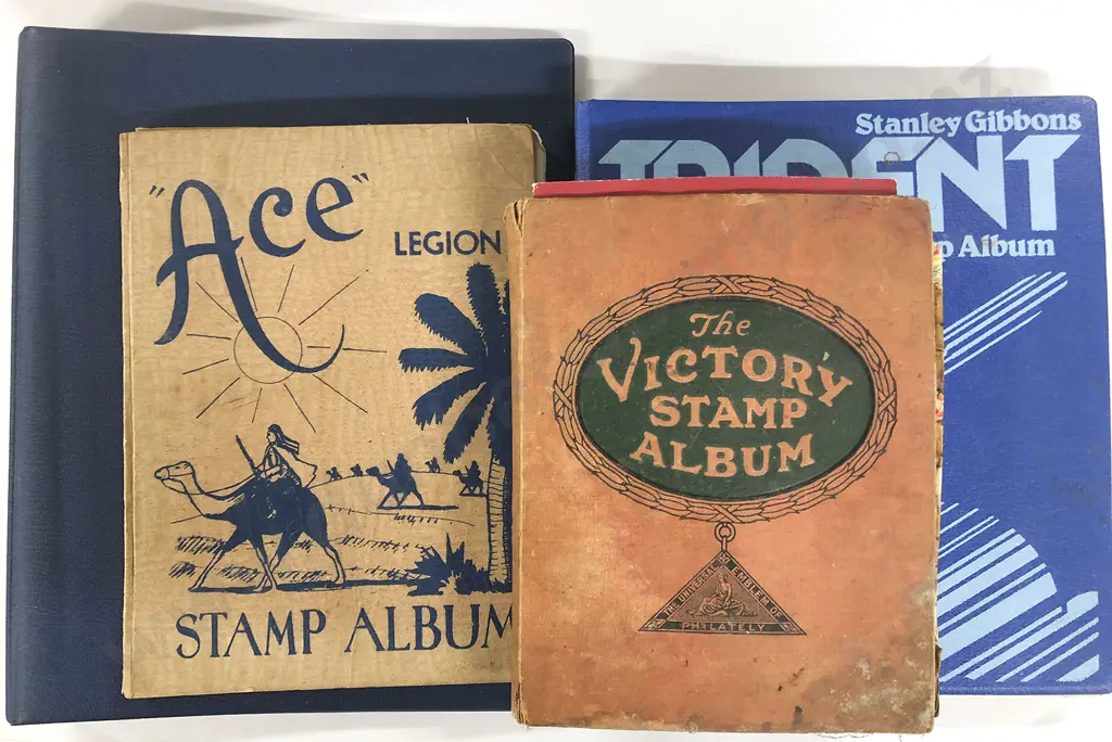Three Vintage World Stamp Albums and empty stock page album Image 1++