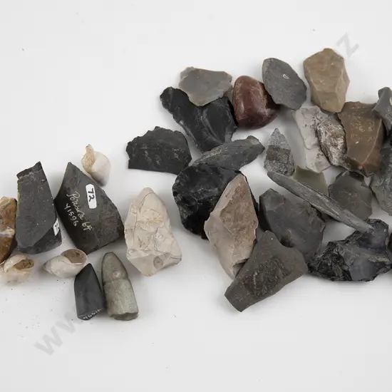 Large collection of adze cutting tips and a Moa Gizzard stone