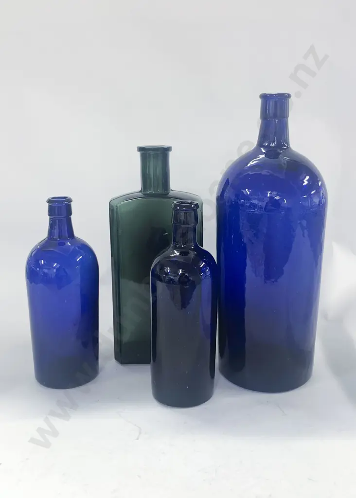 Four Vintage Colored Glass Bottles Image 1++