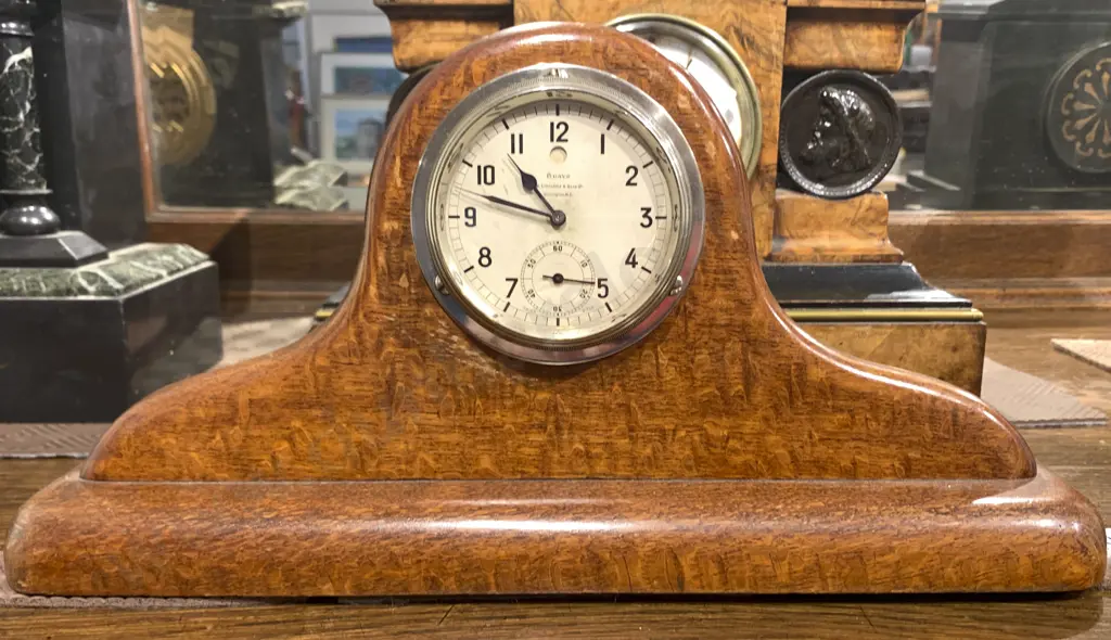 Chrome Cased Timepiece on Riwariwa Stand Image 1++