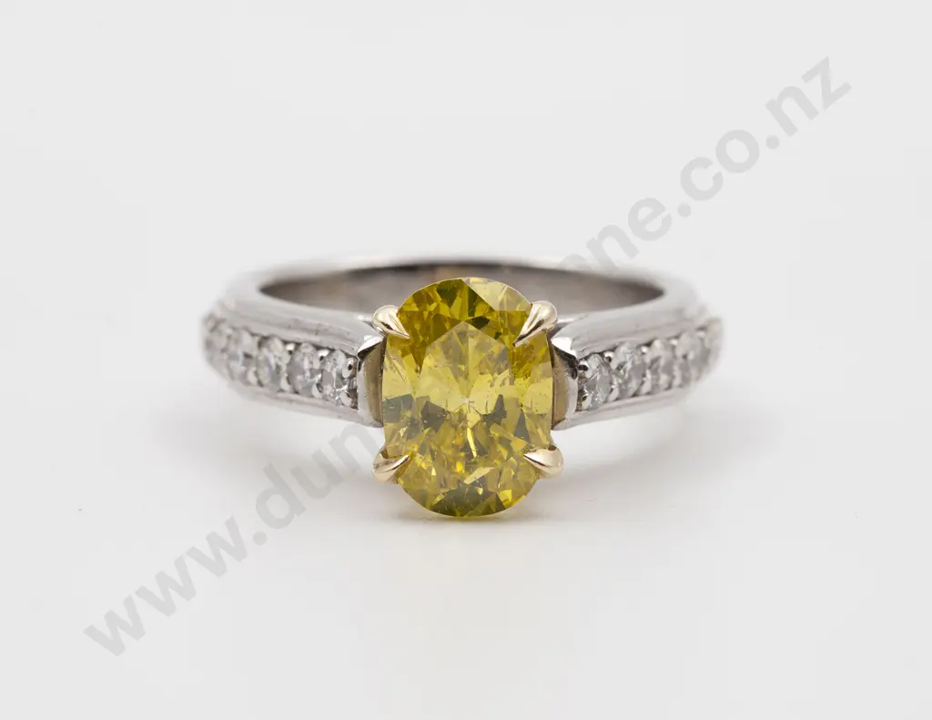 Platinum and 18ct Solitaire Fancy Yellow Diamond Ring Image 1++