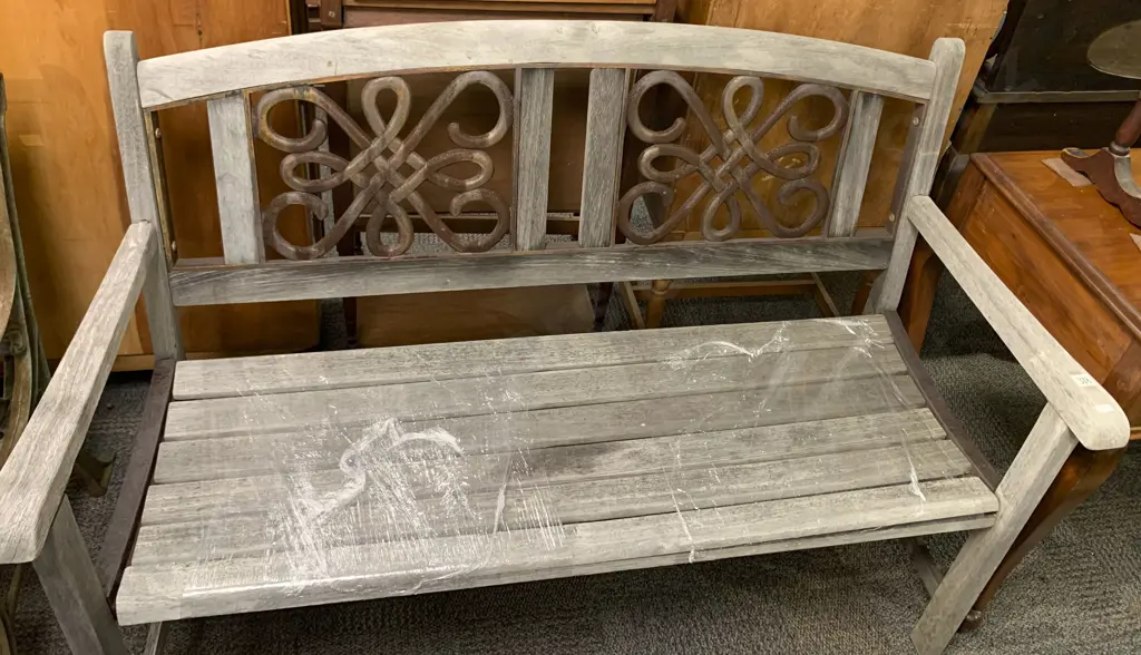 Outdoor Bench Seat With Wrought Metal Design to Back Image 1++
