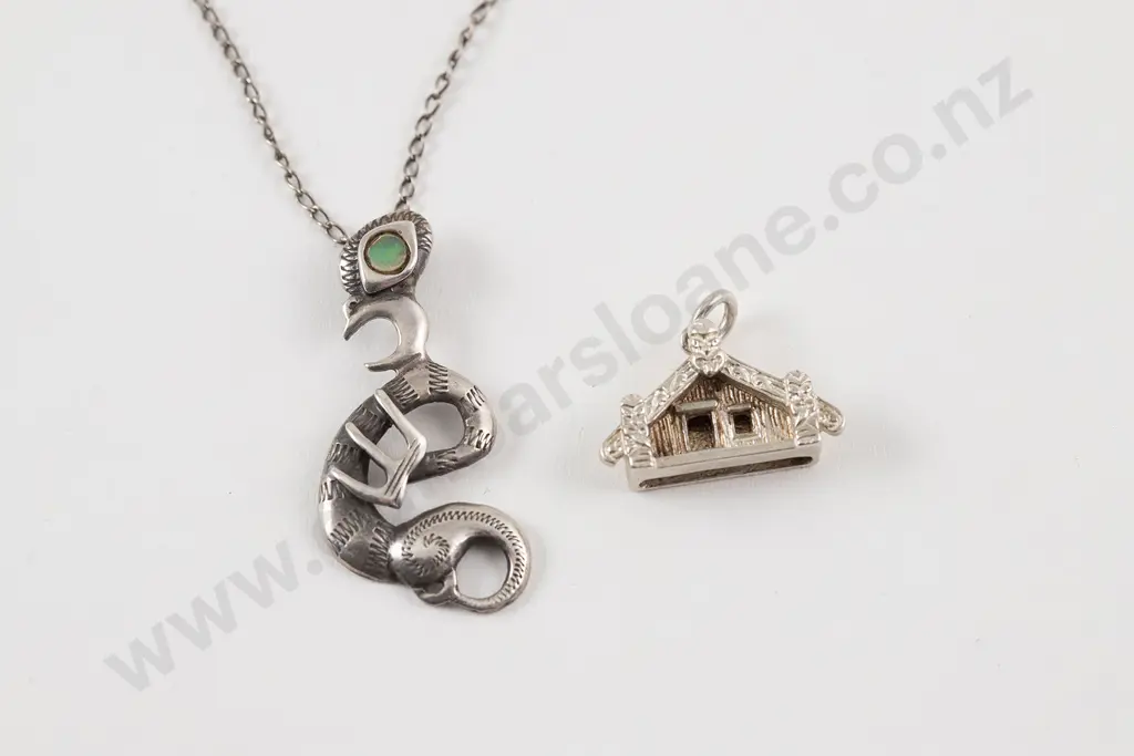Sterling silver taniwhai pendant together with a wharenui pendant Image 1++
