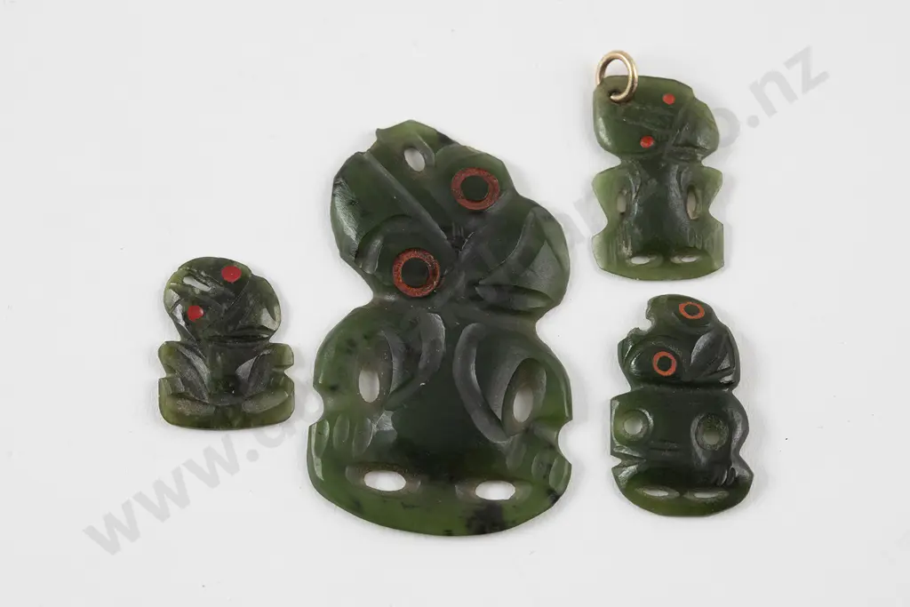 Four Small Pounamu Hei-Tiki of graduated size Image 1++