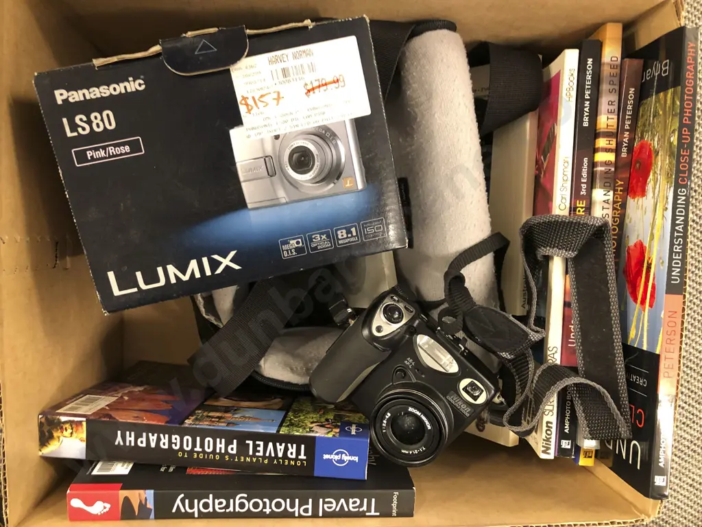 Two Nikon Cameras and One Panasonic Camera Together With Case and Eight Photography Books Image 1++