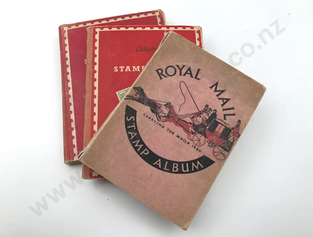 Three Vintage Small World Stamp Albums Image 1++