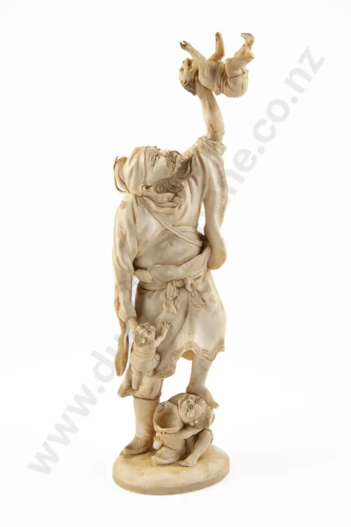 A Japanese Meiji Period Ivory figure of a Bearded Sennin in Battle with Three Oni Image 1++