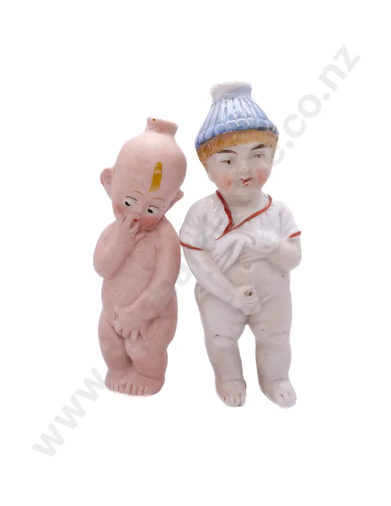 Two All Bisque Character 'Pissing' Dolls Image 1++