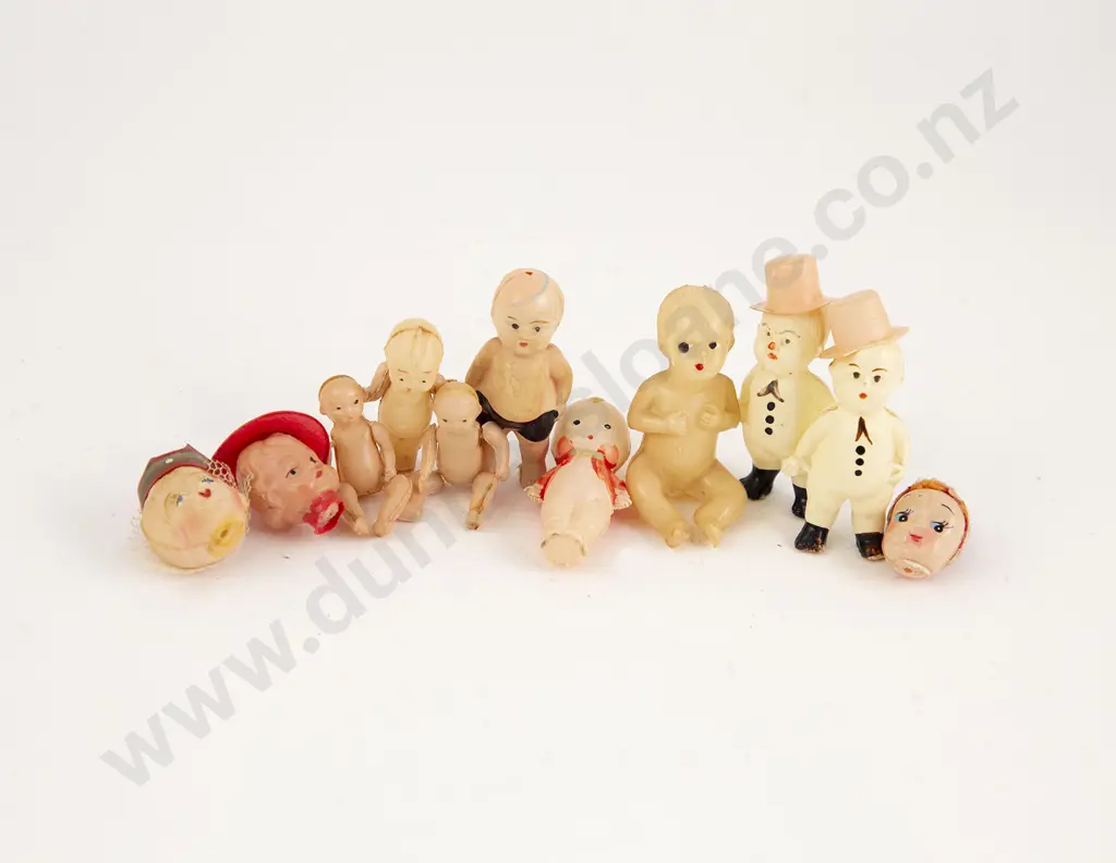 Eight Tiny Celluloid Kewpie and Novelty Dolls Image 1++