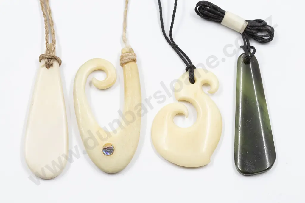 NZ Maori Design Greenstone Pendant and Three Bone Pendants Image 1++