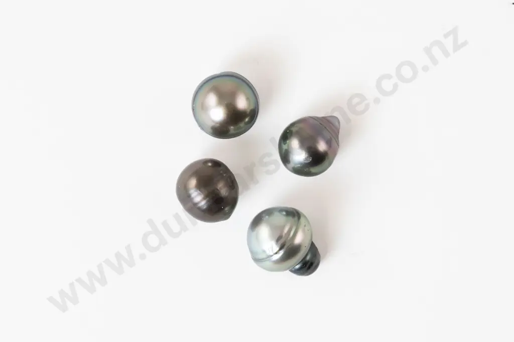 Four Unmounted South Pacific Black Pearls Image 1++