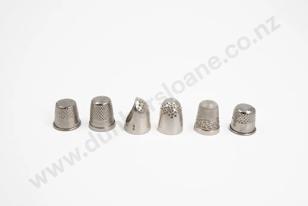Two S/S Finger Guards S/S Thimble and three plated thimbles Image 1++