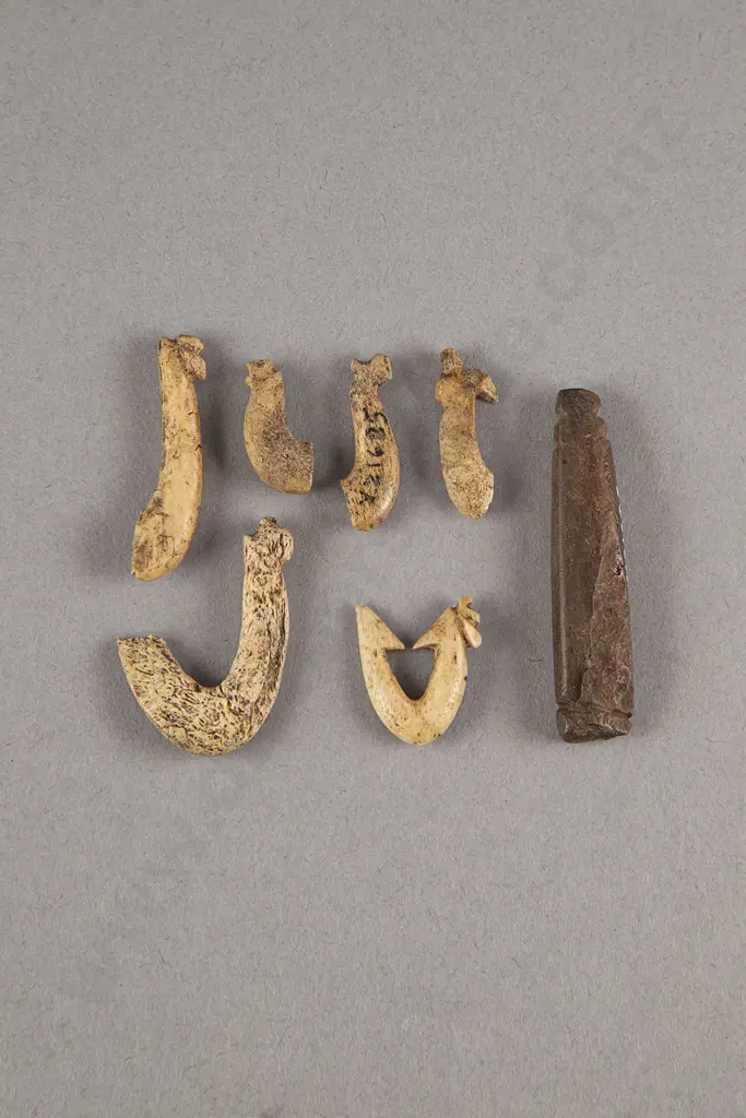A Stone Minnow Lure And Bone Fish Hook With Fragments Image 1++