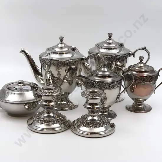 Seven Pieces of S/P Including Pair of Candle Sticks and Tea Pot