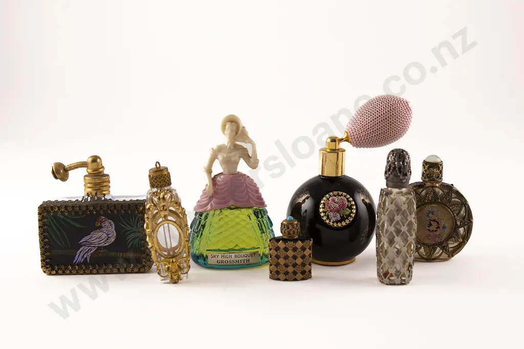 Collection Seven Novelty and Metal Mounted Scent Bottles and Phials Image 1++