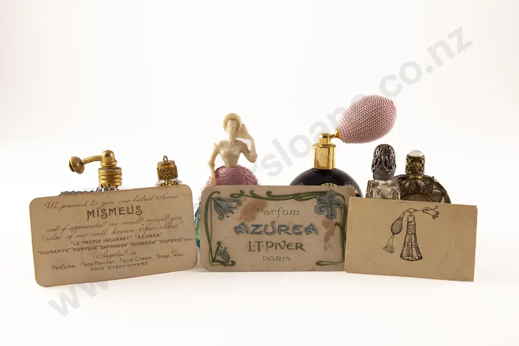 Collection Seven Novelty and Metal Mounted Scent Bottles and Phials Image 1++