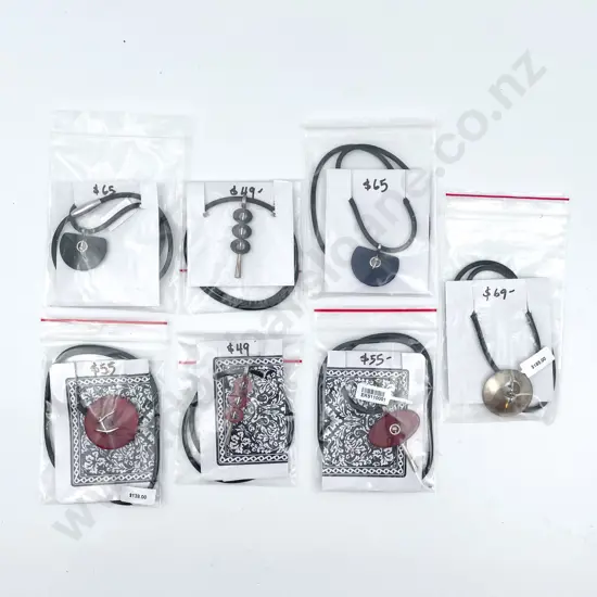 Eight Pendants on Leather Chains