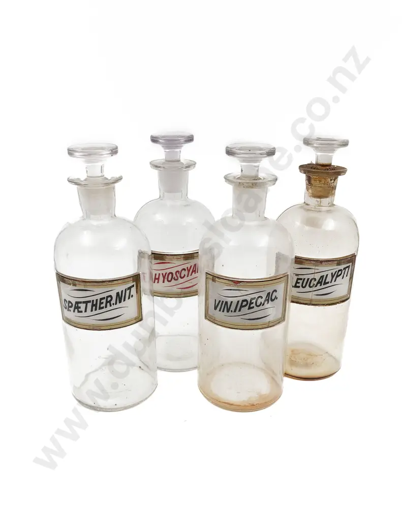 Four Labeled Stoppered Chemist Bottles Image 1++