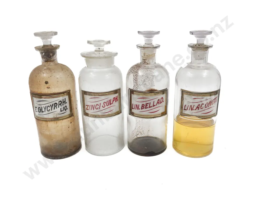 Four Labeled Stoppered Chemist Bottles Image 1++