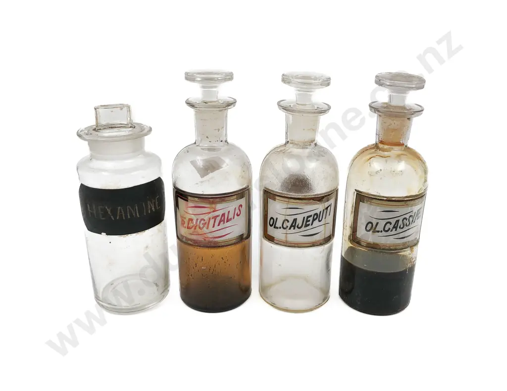 Four Small Labeled Stoppered Chemist Bottles Image 1++