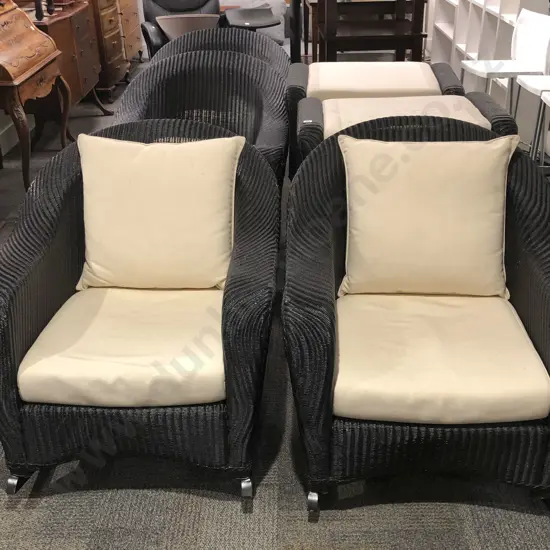 Outdoor Suite of Four Wicker Rocking Arm Chairs Together with Four Matching Footstools