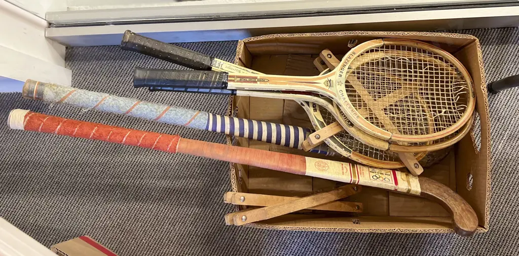 Box of Assorted Tennis Racquets and Hockey Sticks Image 1++