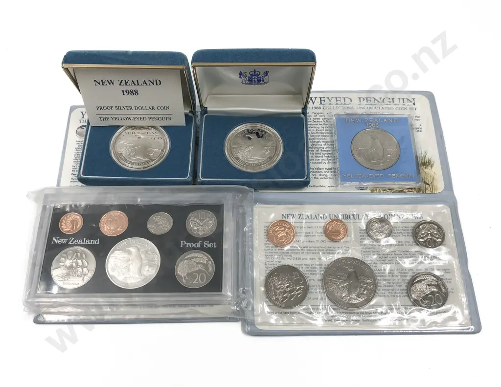 Two NZ 1988 Coin Sets Together with Three 1988 Yellow Eyed Penguin Proof Dollars Image 1++
