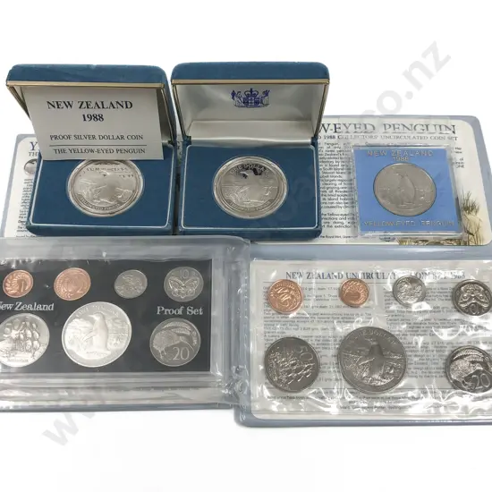 Two NZ 1988 Coin Sets Together with Three 1988 Yellow Eyed Penguin Proof Dollars