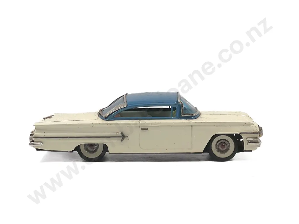 San Mark Cadillac and Unmarked Sedan Image 1++