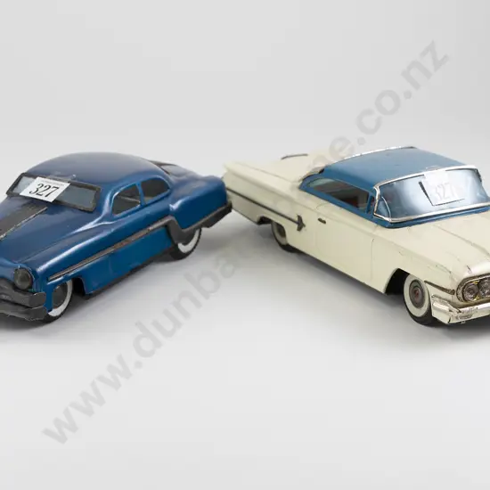 San Mark Cadillac and Unmarked Sedan