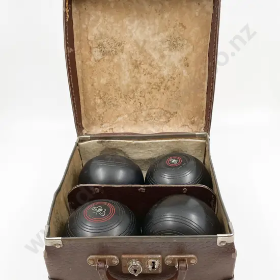 Four Lawn Bowls in Case